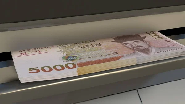 5000 South Korean won in cash dispenser. Withdrawal of cash from an ATM. Financial transaction in the bank terminal. KRW.
