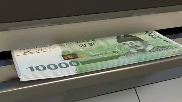 10000 South Korean won in cash dispenser. Withdrawal of cash from an ATM. Financial transaction in the bank terminal. KRW.