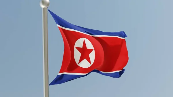 North Korean flag on flagpole. DPRK flag fluttering in the wind. National flag.