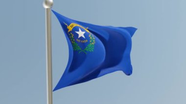 Nevada flag on flagpole. NV flag fluttering in the wind. USA. National flag.