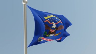 North Dakota flag on flagpole. ND flag fluttering in the wind. USA. National flag.