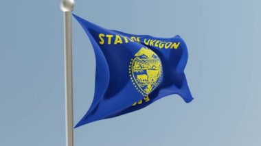 Oregon flag on flagpole. OR flag fluttering in the wind. USA. National flag.