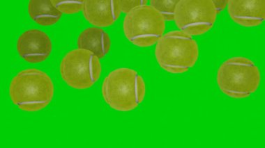 Many tennis balls falling down on chromakey background. Green screen. Sport concept.