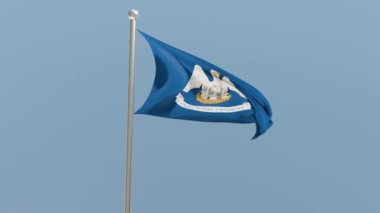 Louisiana flag on flagpole. LA flag fluttering in the wind. USA. National flag.