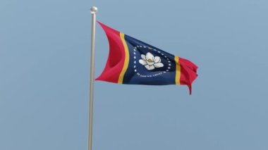 Mississippi flag on flagpole. MS flag fluttering in the wind. USA. National flag.