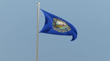 New Hampshire flag on flagpole. NH flag fluttering in the wind. USA. National flag.