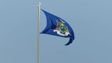 New York flag on flagpole. NY flag fluttering in the wind. USA. National flag.