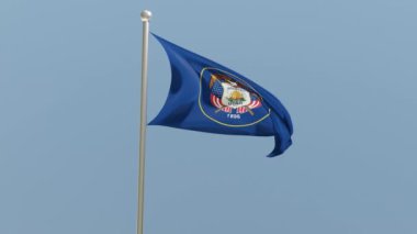 Utah flag on flagpole. UT flag fluttering in the wind. USA. National flag.