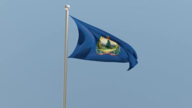Vermont flag on flagpole. VT flag fluttering in the wind. USA. National flag.