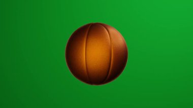 Golden basketball ball rotates on green screen background. Chroma key.