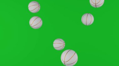 Basketball balls falling down on chromakey background. Green screen. Creative sports footage suitable for sport events or betting promotion.