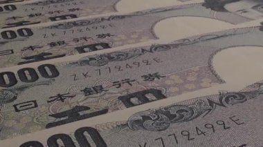 1000 Japanese yen money composition. Financial background. Many banknotes and wads of money. Business or economy concept. Cash.