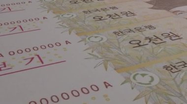 5000 South Korean won money composition. Financial background. Many banknotes and wads of money. Business or economy concept. Cash.
