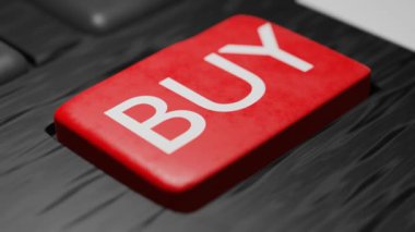 Pressing a buy now button on the keyboard. Online shopping concept. Purchase.