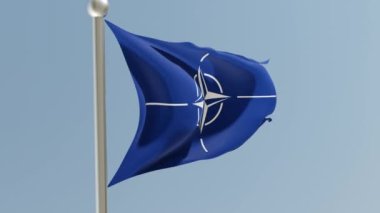 Nato army flag on flagpole. Military organization flag fluttering in the wind.