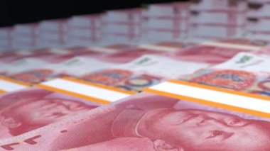 100 Chinese yuan money composition. Financial background. Many banknotes and wads of money. Business or economy concept. Cash.
