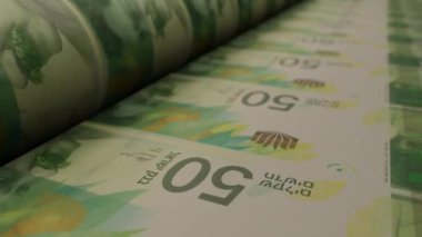 Israeli 50 shekels bills on money printing machine. Video of printing cash. Banknotes.