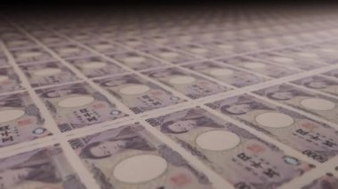 5000 Japanese Yen bills on money printing machine. Video of printing cash. Banknotes.