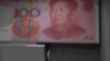 100 Chinese Yuan in cash dispenser. Withdrawal of cash from an ATM. Financial transaction in the bank terminal. CNY.