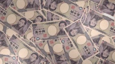 5000 Japanese yen money composition. Financial background. Many banknotes and wads of money. Business or economy concept. Cash.
