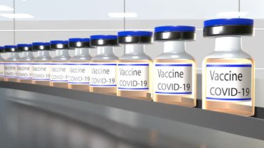 Vaccine production. Many Covid-19 vaccine vials in production. Factory.