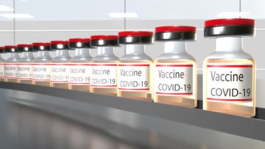 Vaccine production. Many Covid-19 vaccine vials in production. Factory.