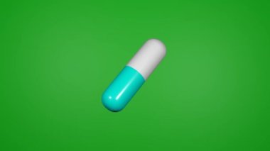 Haplar krom anahtar arka planında döner. Tıp konsepti. Kapsül.