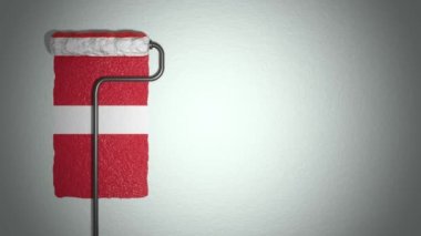 Patenci, duvarı Danimarka bayrağına boyuyor. Seyahat konsepti. Danimarka.