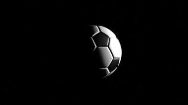 Siyah arka planda futbol rotasyonu. Spor konsepti.