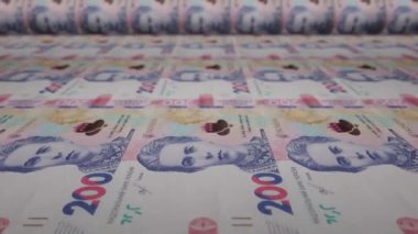 200 Ukrainian hryvnia bills on money printing machine. Video of printing cash. Banknotes. UAH. Economy.