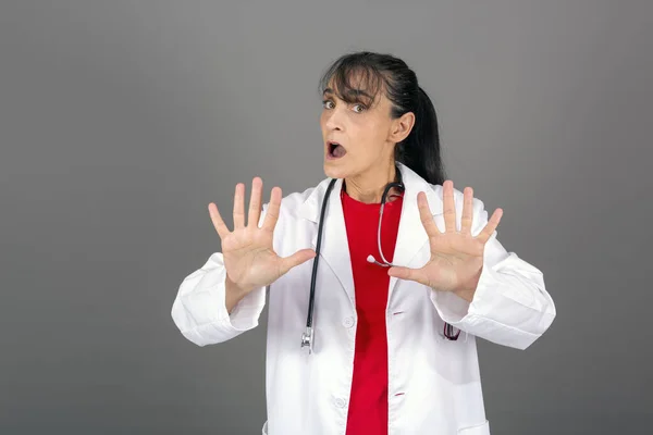 Female Doctor Making Stop Gesture Her Palm Warning Expression Serious — ストック写真