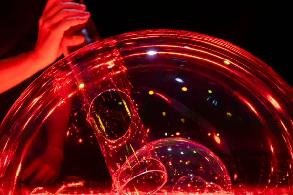 Blowing Double Soap Bubble Made Tube Illuminated Red Creating Original — Foto de Stock