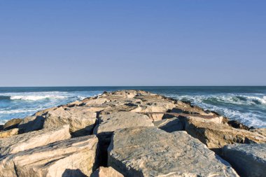 spectacular view of rock breakwater