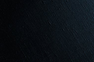 koyu yaratıcı arkaplan: siyah astarlı keten tuval, düzensiz ışıklandırma, renk tonu 
