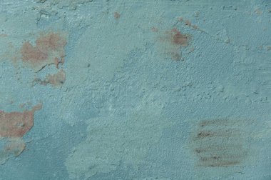 Dekoratif alçıyla kaplı yüzey kaotik desenli, çok renkli benekli. 