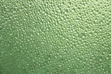 ferahlatıcı arkaplan: şeffaf bir yüzeydeki çiy taklidi, renk tonlama, kısa odaklanma. 