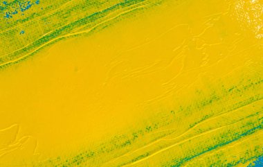 soyut parlak renkli arkaplan: mavi bir kumaş üzerinde sarı boya lekesi 