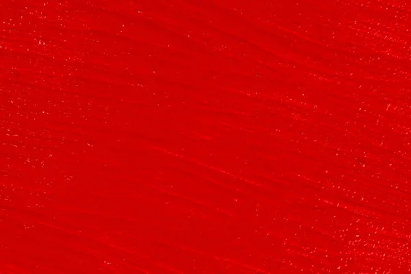 Parlak Kırmızı Arkaplan Düz Bir Yüzey Üzerindeki Kalın Akrilik Boya — Stok fotoğraf
