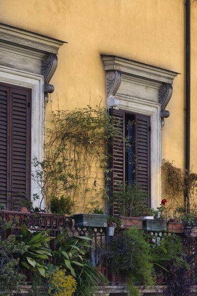 Balcony with flowers in spring in Italy . High quality photo