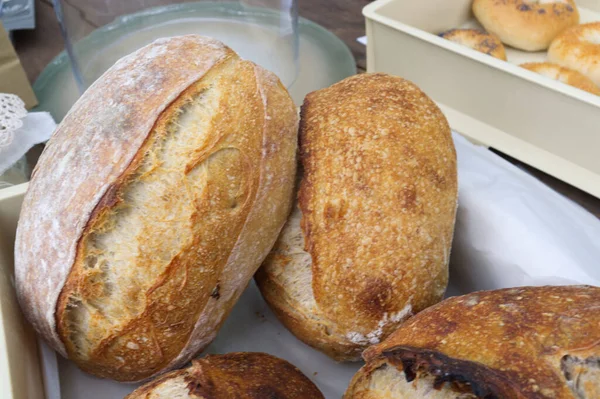 Bread close-up. Freshly baked sourdough bread with a golden crust  . Concept bakery , texture sourdough bread