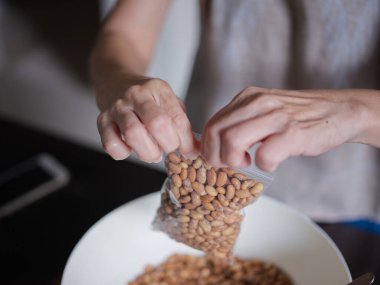 Close-up photo the texture of soy bean for HOW to Soy Product: Raw Homemade Tempeh . Concept of Healthy Vegetarian Food
