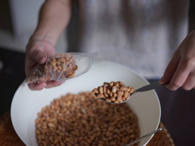 Close-up photo the texture of soy bean for HOW to Soy Product: Raw Homemade Tempeh . Concept of Healthy Vegetarian Food
