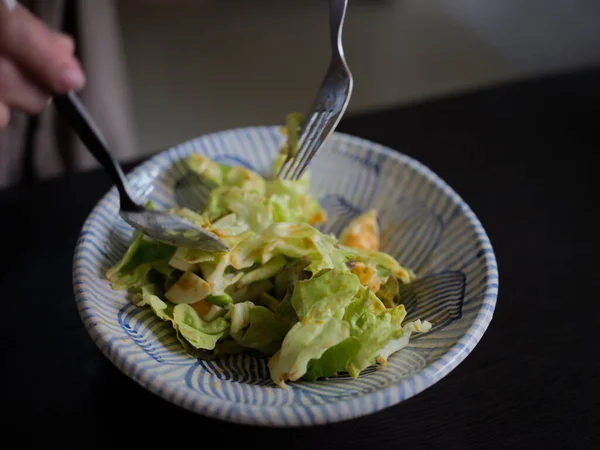 Woman Mixing Delicious Food Salad Ingredients Spoons Kitchen —  Fotos de Stock