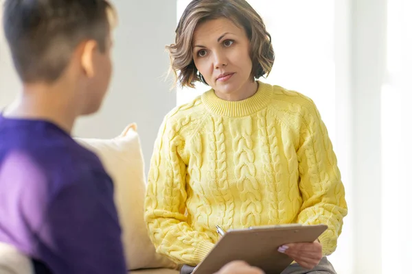 Middle Aged Woman Psychologist Accepts Teenager Light Office Writes His — Stock Photo, Image