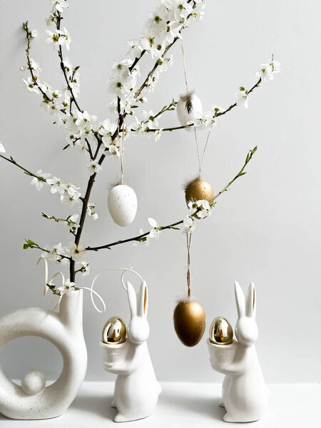 Easter composition on a light background with a hare and eggs