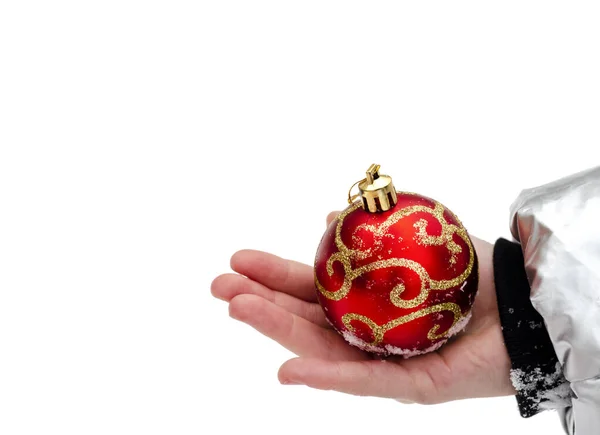 Red Christmas Ball Gold Border Lying Child Hand White Background — Stock Photo, Image