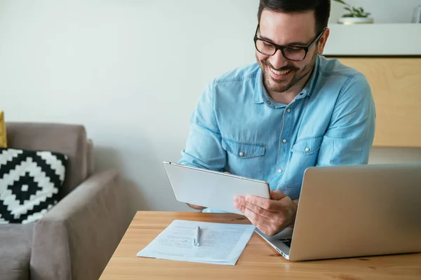 stock image Happy Business Man Using Digital Tablet While Working at Home