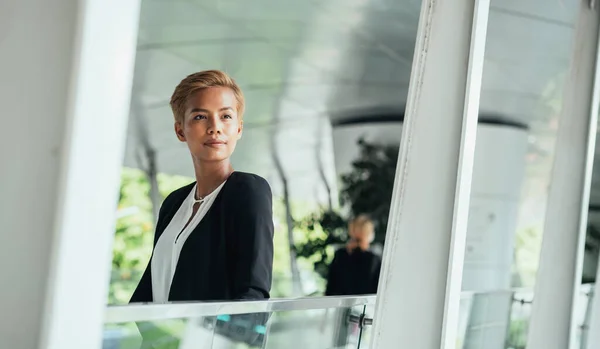 Serious Business Woman Standing At Modern Terrace