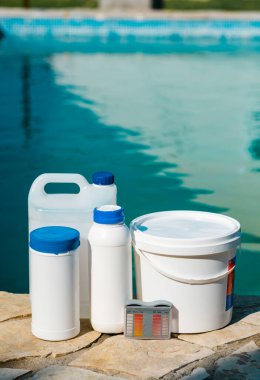 High Angle View Of Outdoor Pool Chemistry Testing And Maintenance Tools