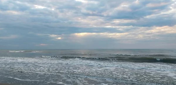 sea background: sea, sky with clouds, sandy beach